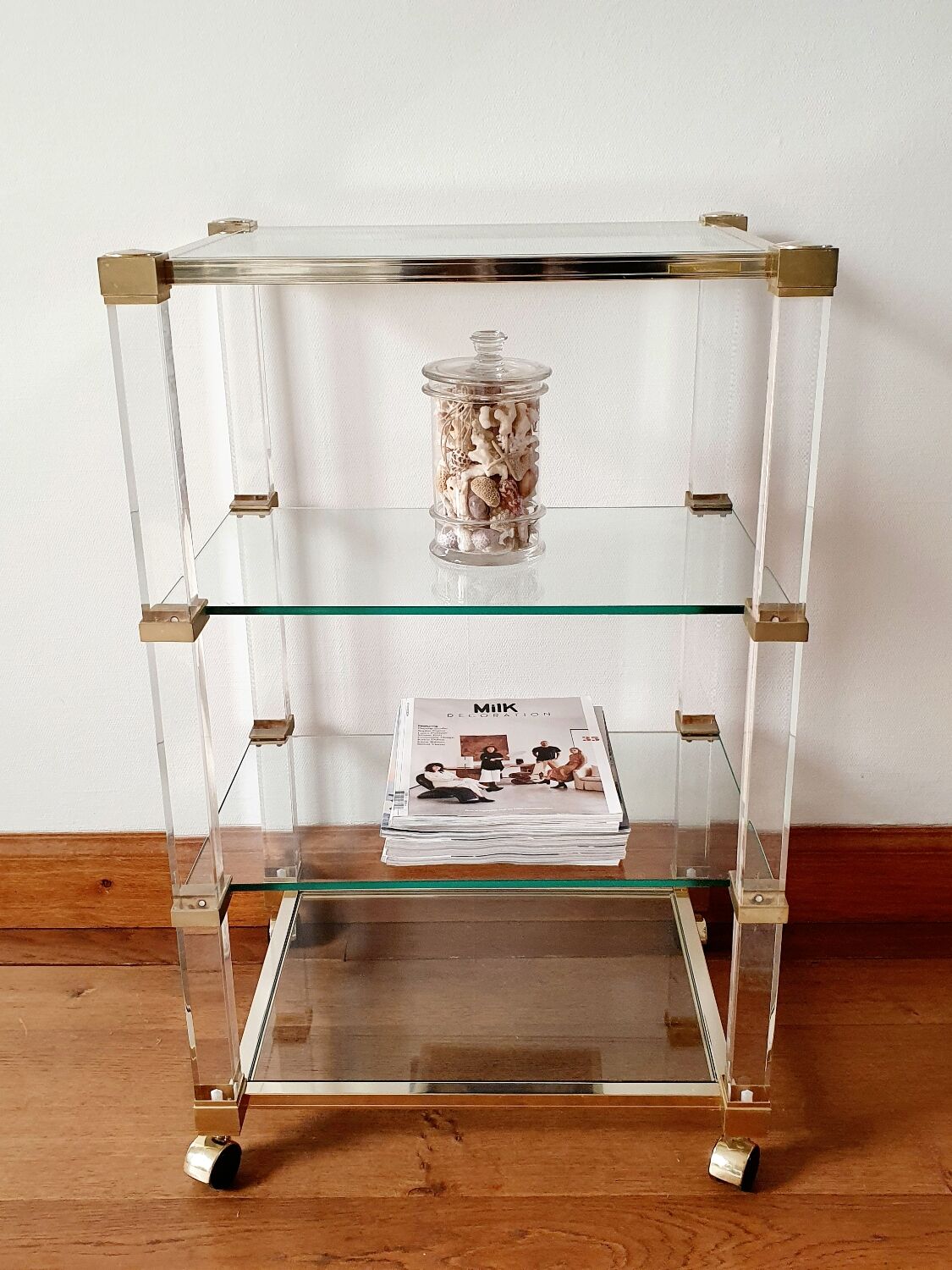 Rolling glass and plexiglass shelf by Pierre Vandel