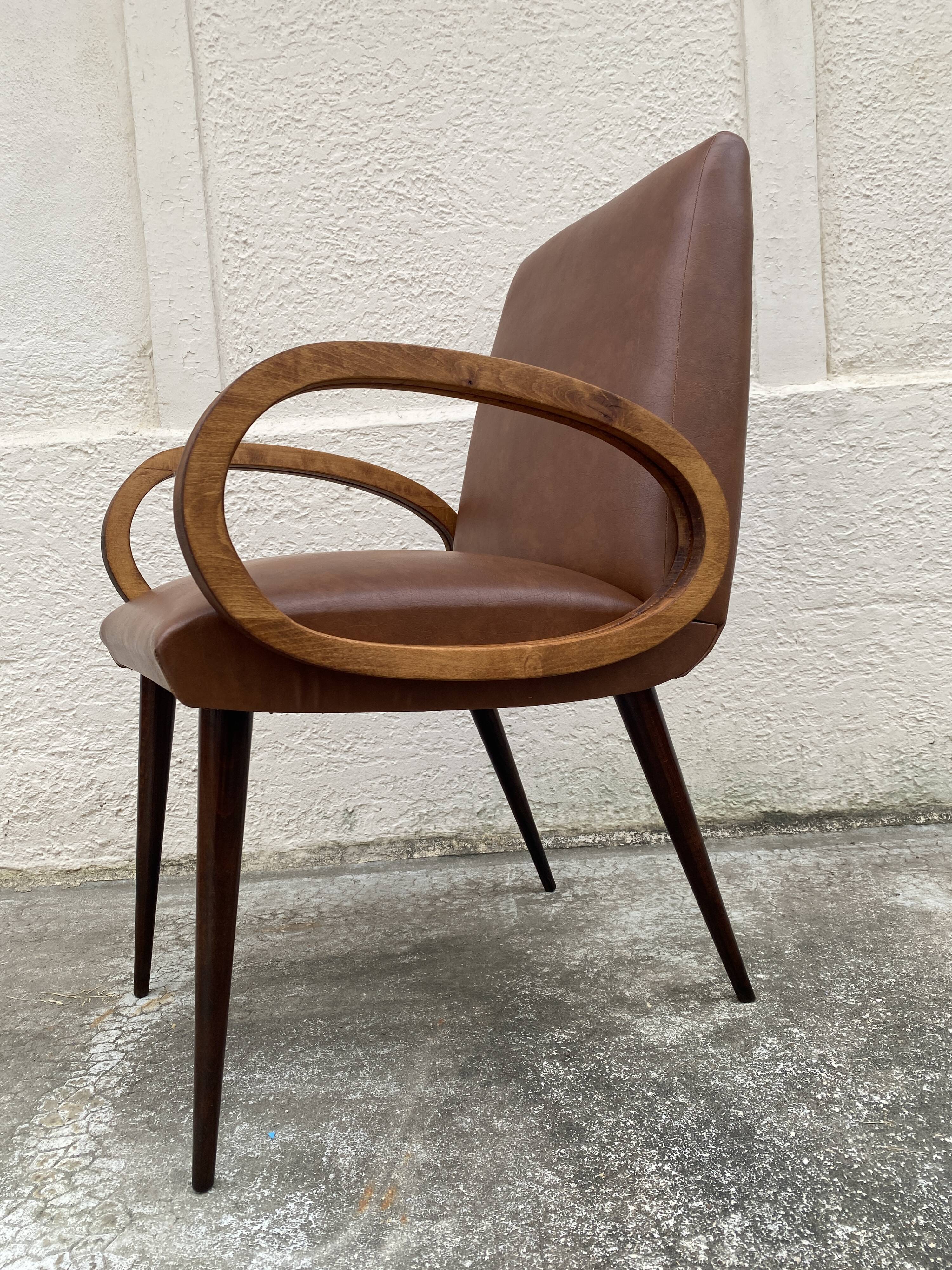 Mid-Century Scandinavian vintage retro armchair with oval armrests.