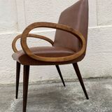 Mid-Century Scandinavian vintage retro armchair with oval armrests.