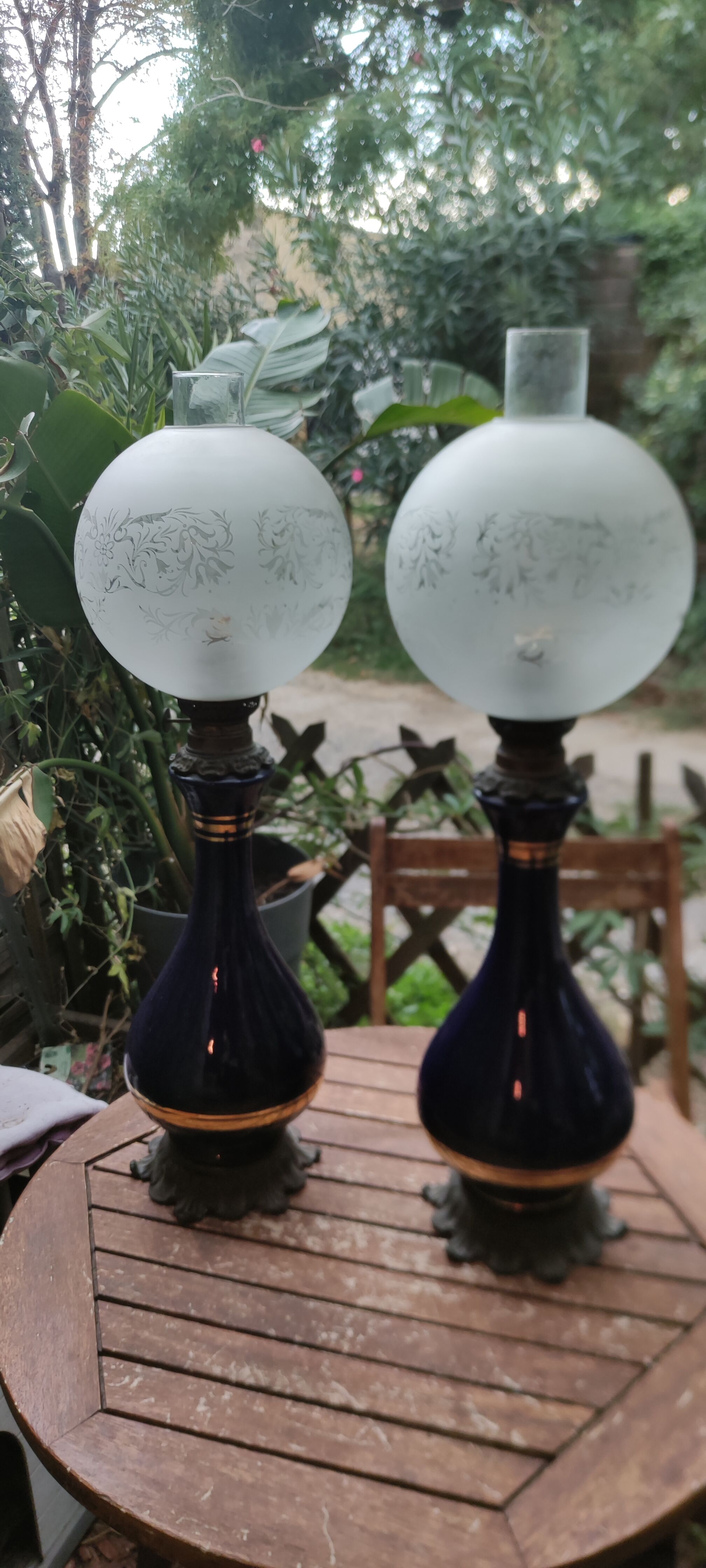 Pair of dark blue kerosene lamps