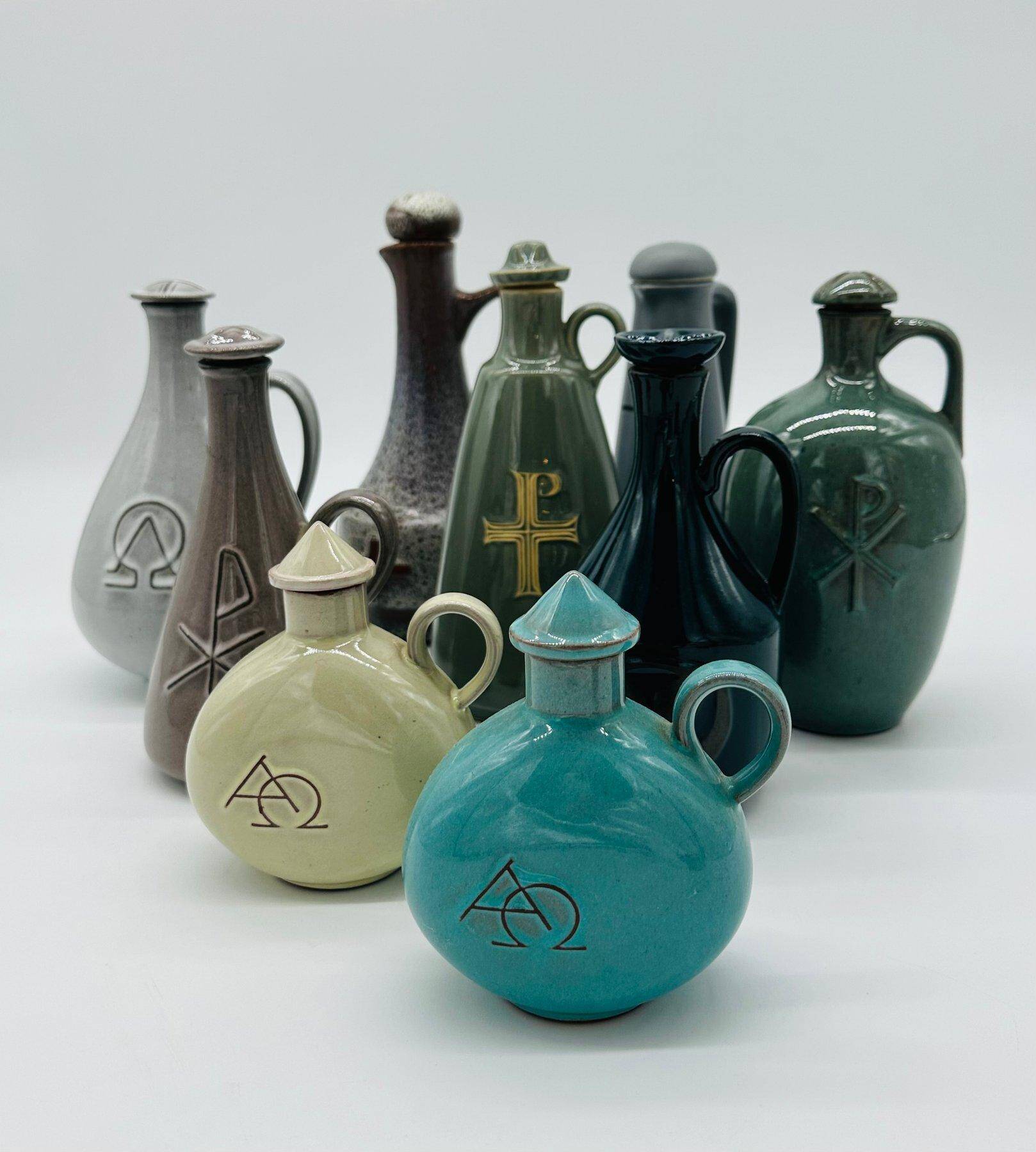 Set of nine modern sculptural ceramic vases from the mid-century, Bauhaus influence.