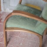 Art Deco armchair in wood and green fabric, living room armchair, interior decor.