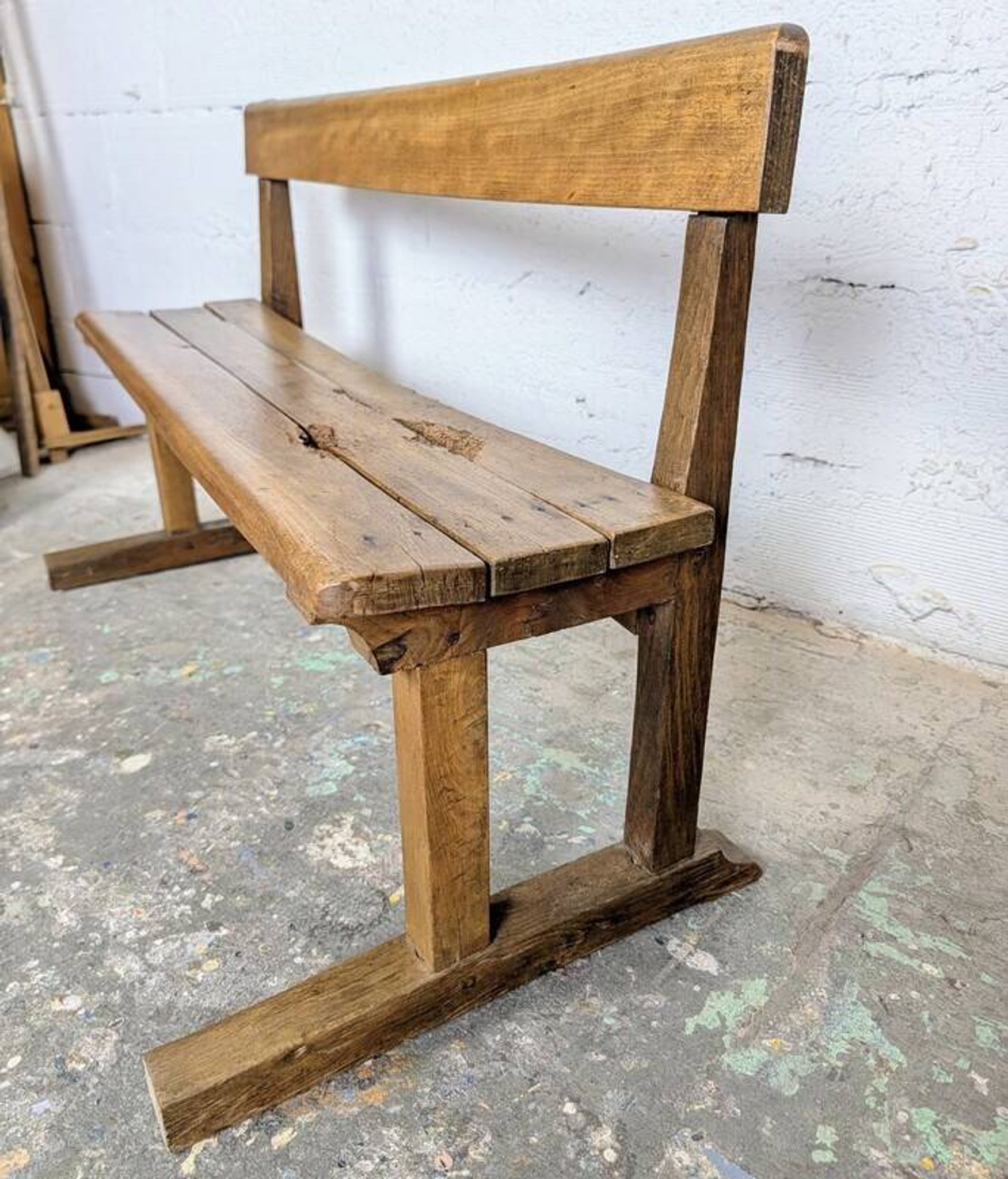 Double school desk and its wooden bench
