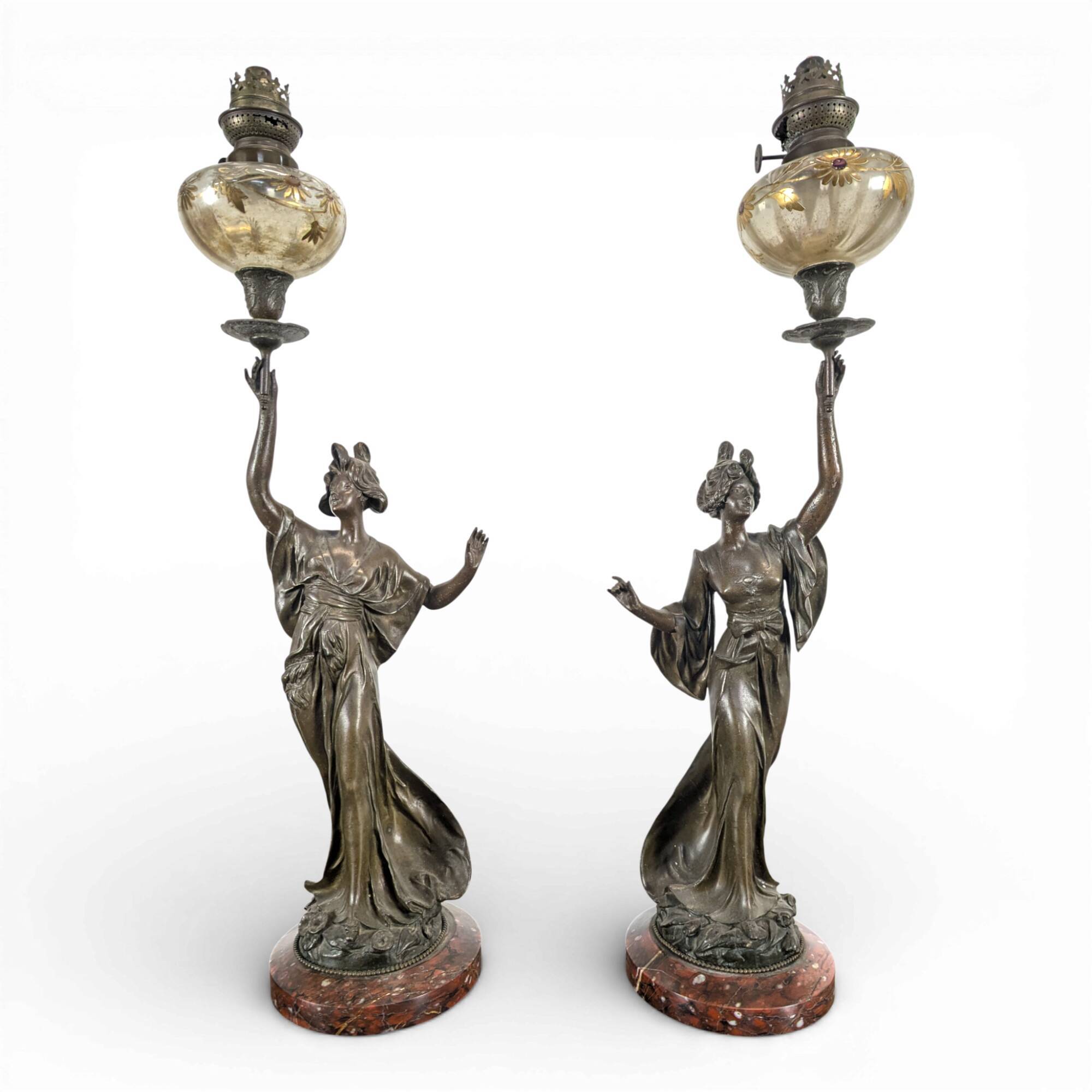 Pair of Art Nouveau oil lamps in cast iron