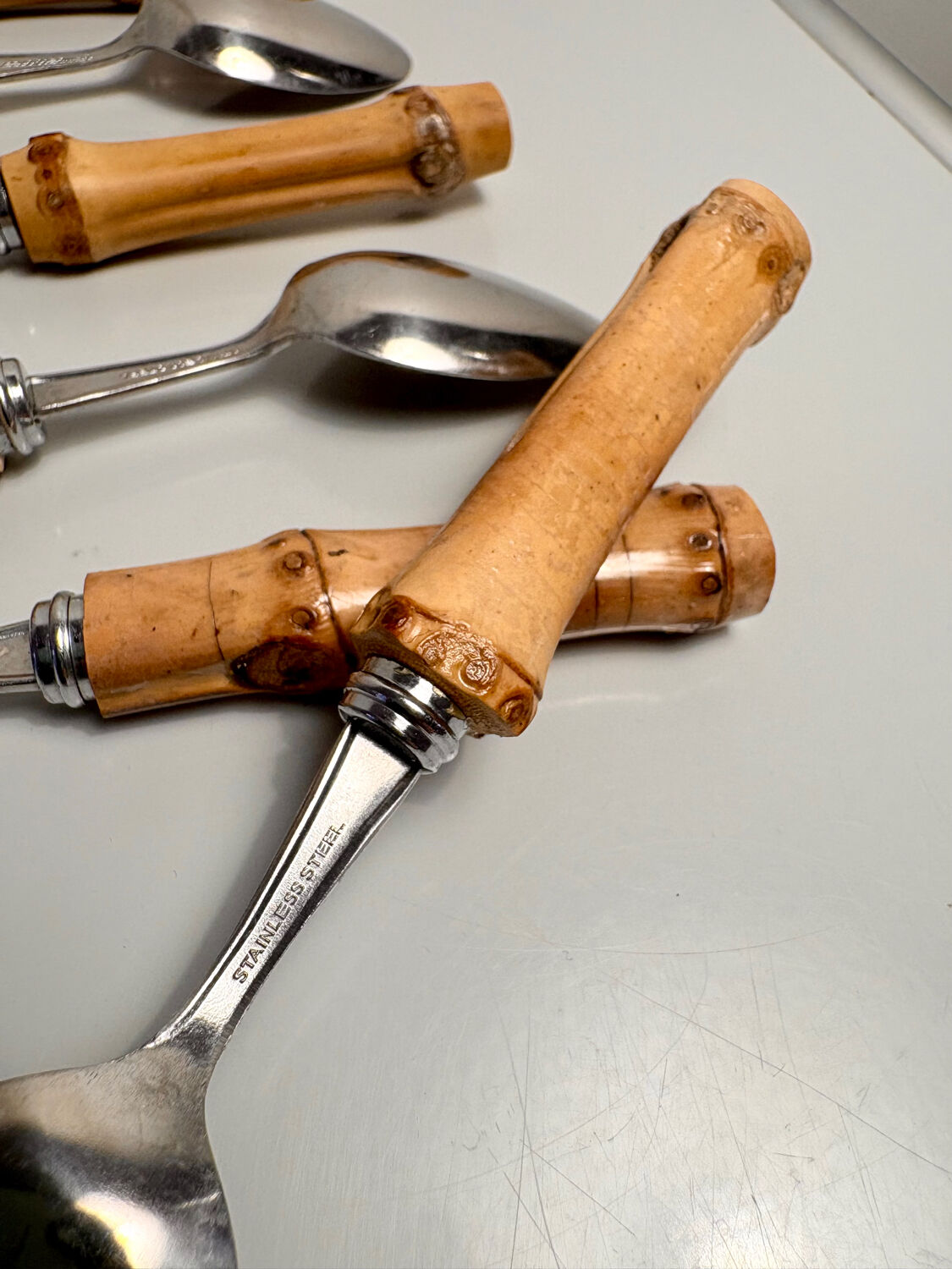 Set of 6 vintage dessert spoons with bamboo handles.