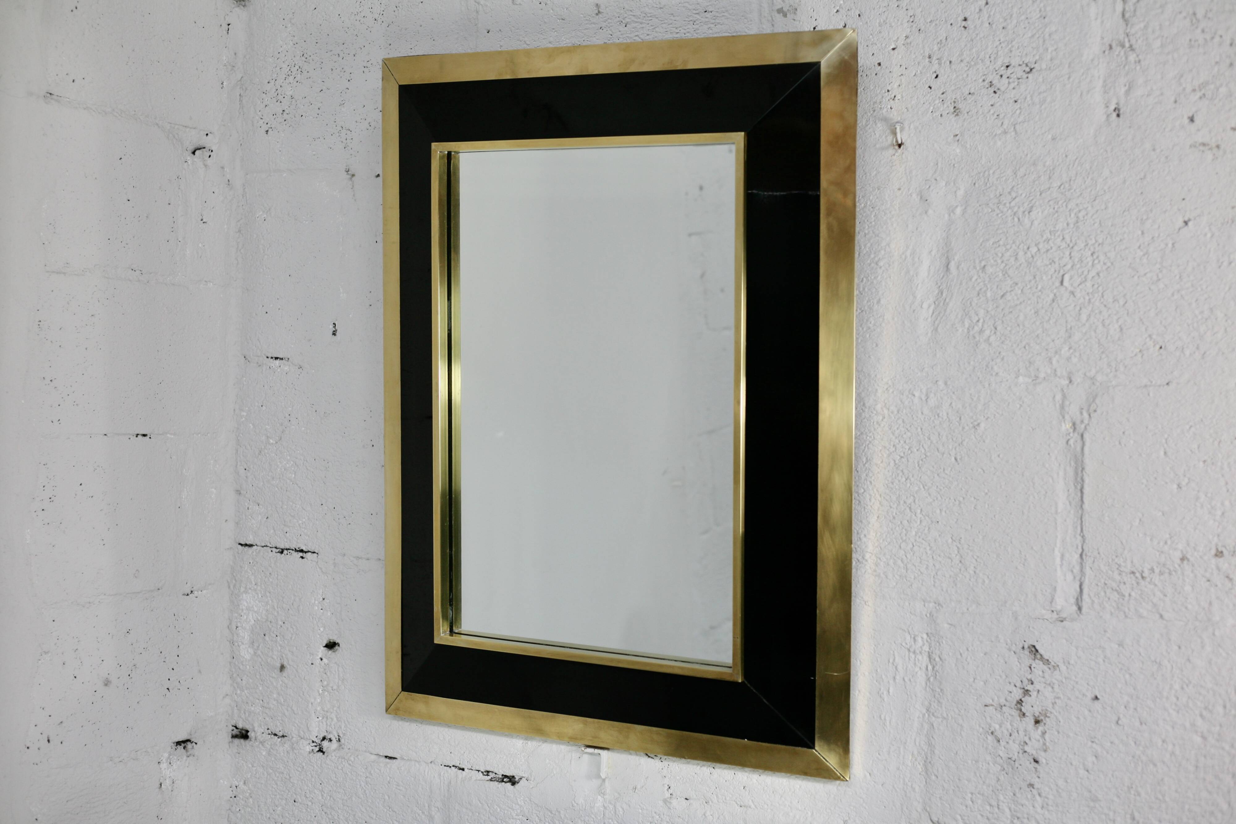 Jean-Claude Mahey mirror. Black lacquered wood and gold metal. 1970