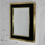 Jean-Claude Mahey mirror. Black lacquered wood and gold metal. 1970