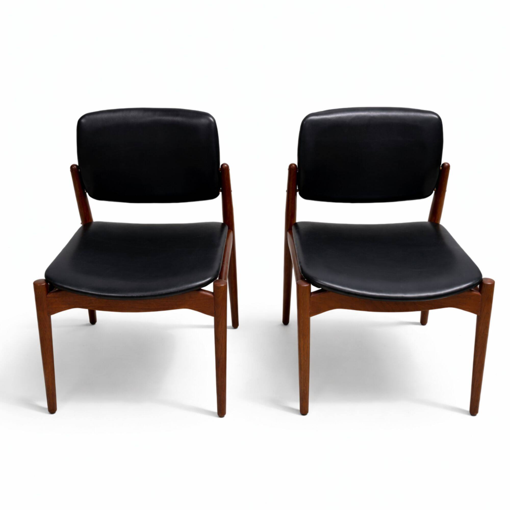 Captain chair pair by Erik Buch