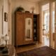 Art deco wardrobe in raw oak with bevelled mirror.