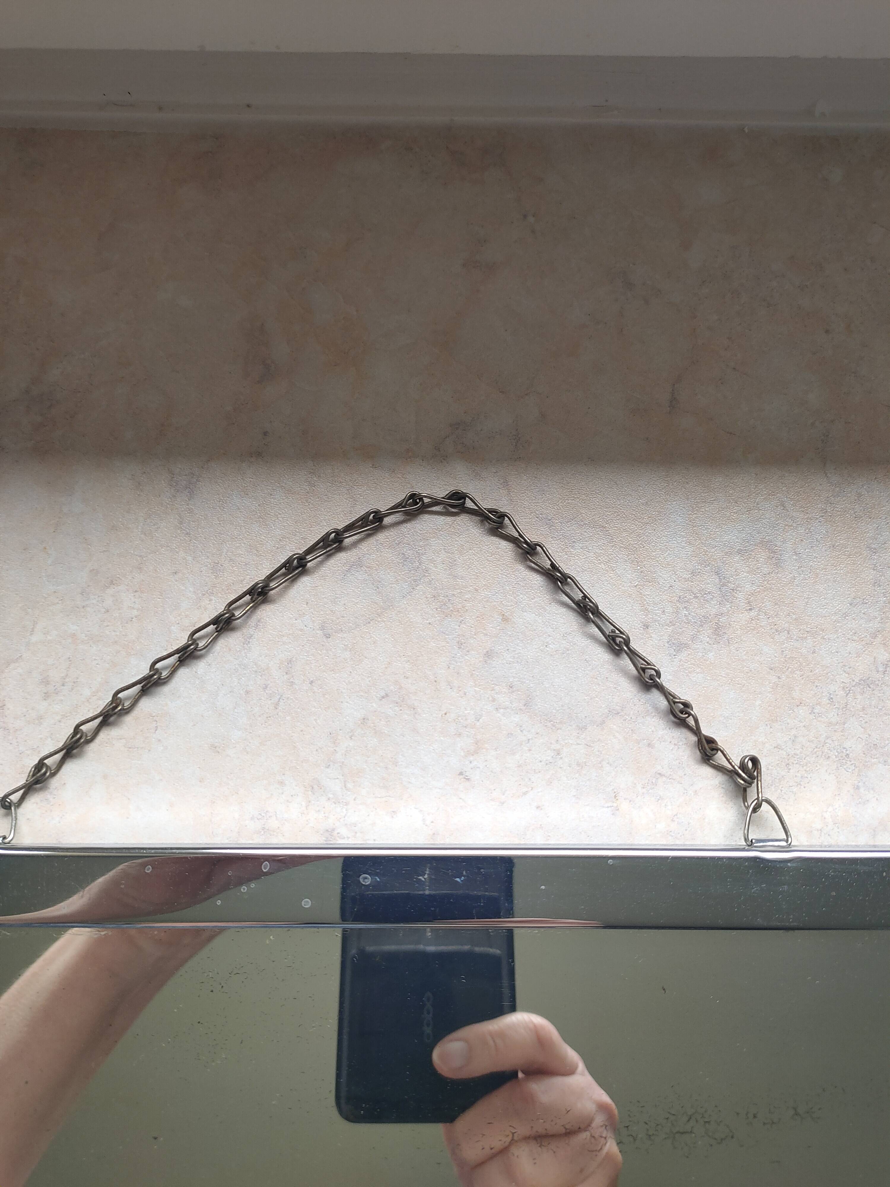Barber mirror with chain.