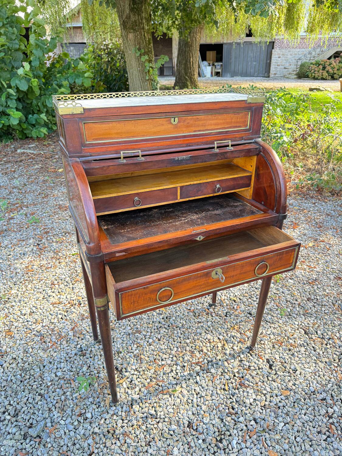 Elegant and rare Louis XVI period mahogany cylinder desk