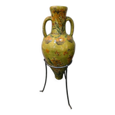 Large decorative vase with handles – painted floral design – on a metal stand