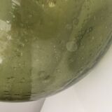 Old demijohn full of bubbles