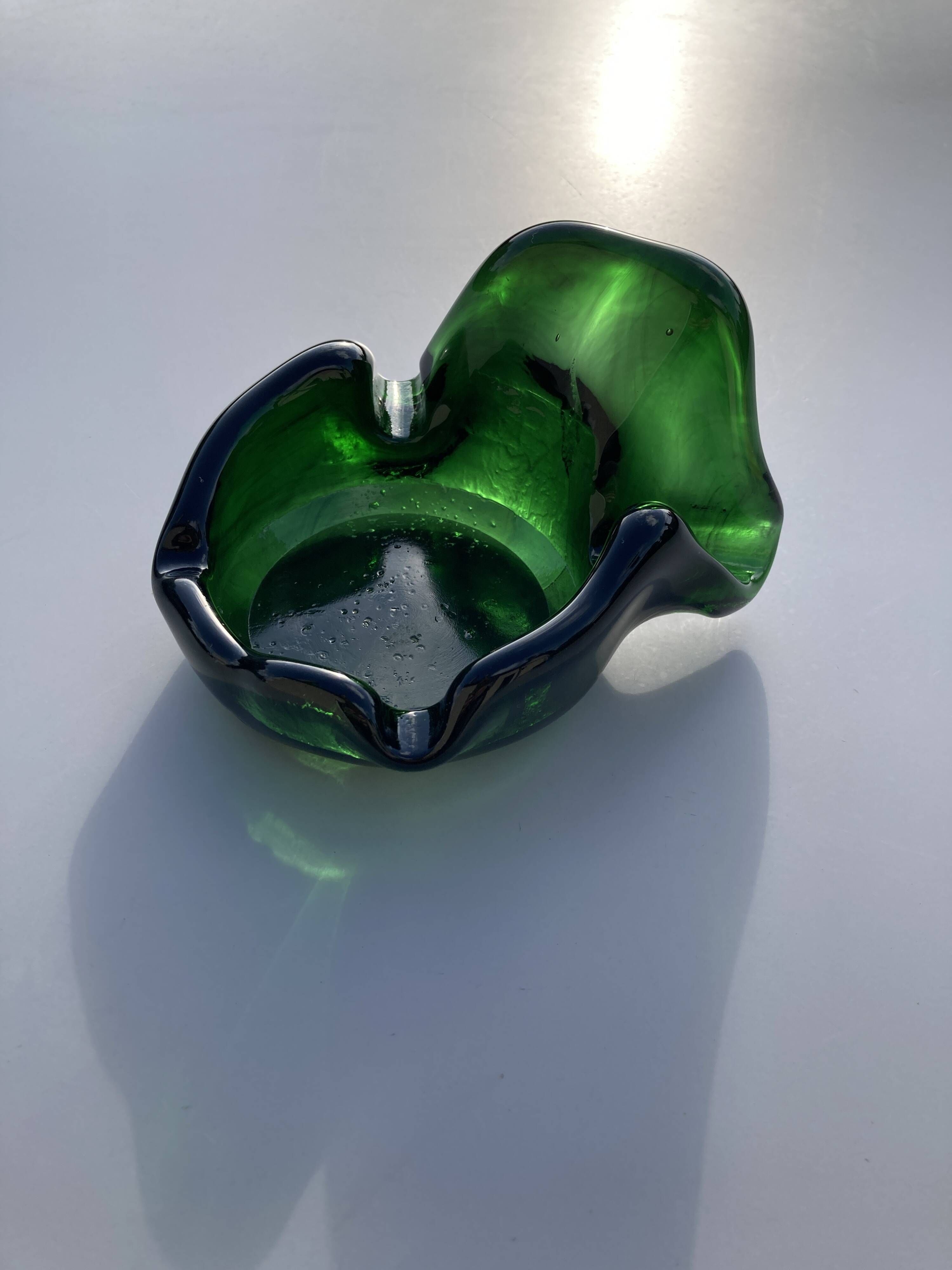 Sculptural ashtray in emerald green glass