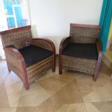 2 colonial-style armchairs in woven rattan and exotic wood