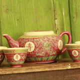 Chinese pink mu shou teapot and its cups