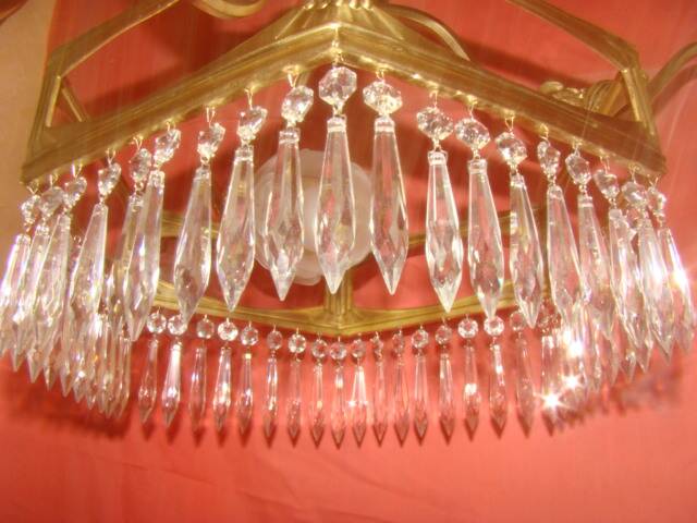 Art Deco period chandelier (1925) with four light arms.