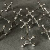 Set of 7 vintage knife rests in the shape of crosses in silver-plated metal.