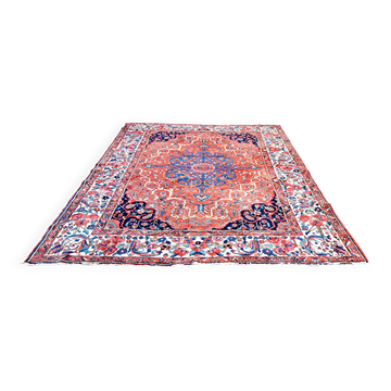 Tapis persan ancien en laine tissée à la main. Très bon état.
