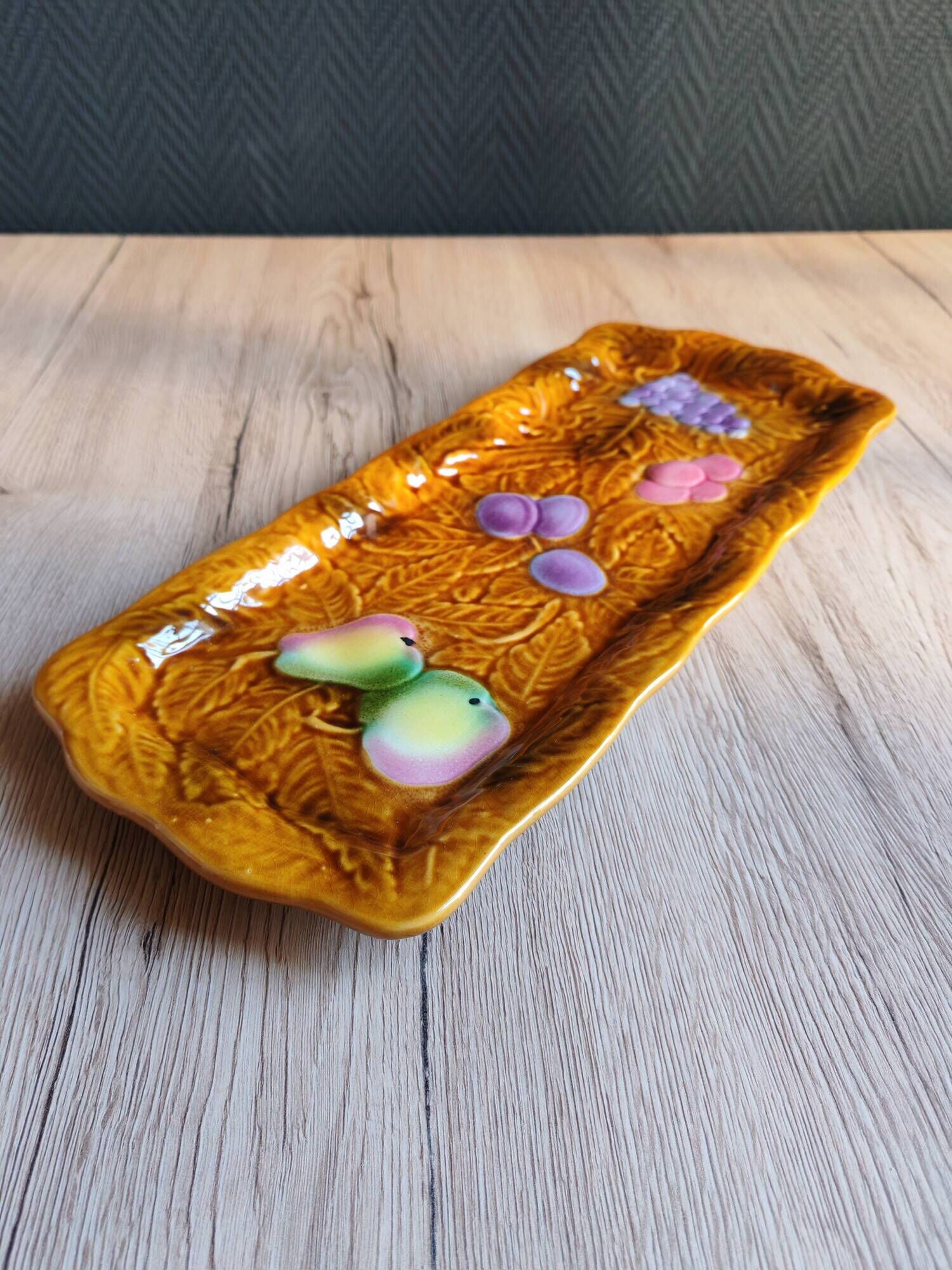 Vintage barbotine pocket dish from Salins les Bains, relief decoration of fruits.