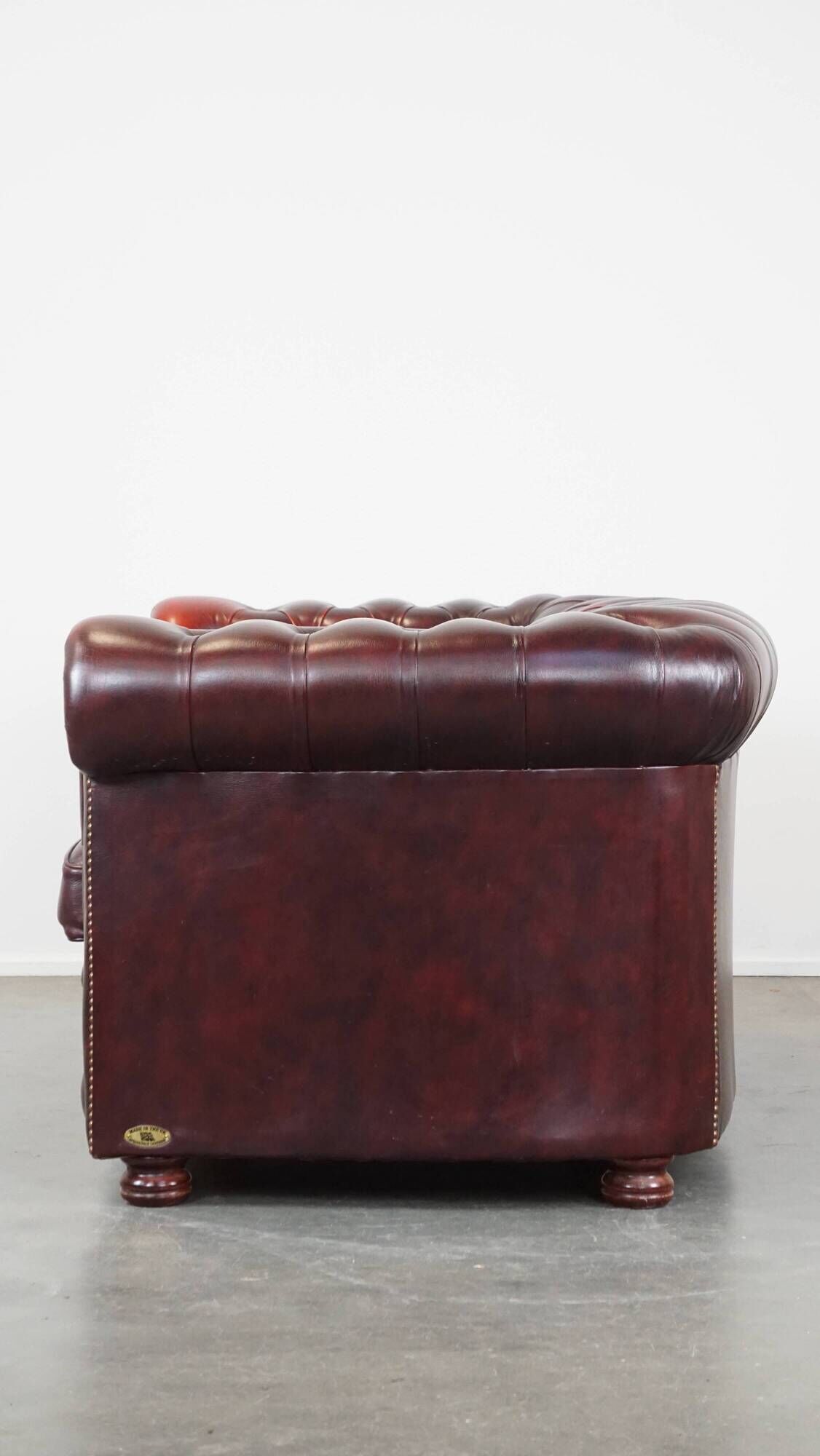 Original English Chesterfield sofa in red cowhide 2 seater