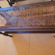 Magazine/book rack in oak with a caned top - early 20th century
