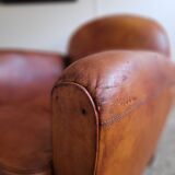 Fauteuil club en cuir patiné