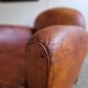 Patinated leather club armchair