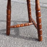 Wooden tripod stool with turned legs