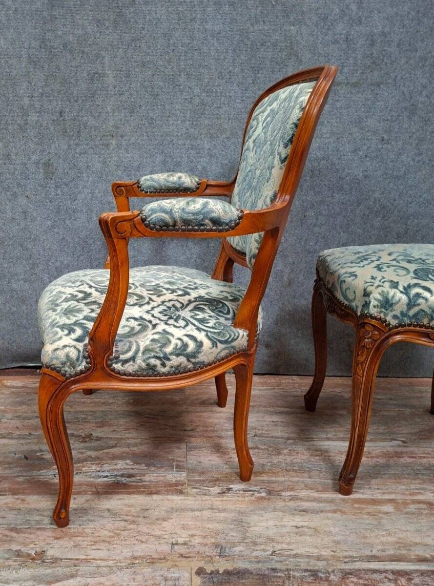 Cabriolet armchair in cherry wood with its footrest, 20th century.