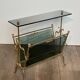 Brass magazine rack and blue-tinted glasses