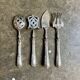 4 silver bonbon spoons engraved "HS"