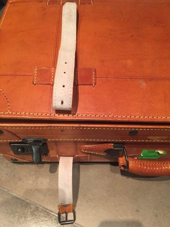 Thick leather suitcase