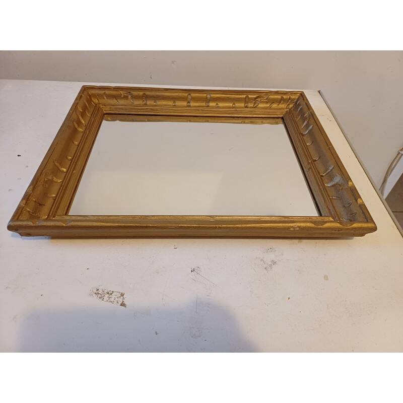 Wooden mirror and gold trim