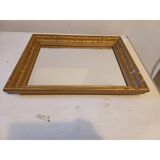 Wooden mirror and gold trim