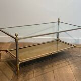 Coffee table in brass, brushed steel, glass, and gilded eglomisé mirror from Maison Jansen.