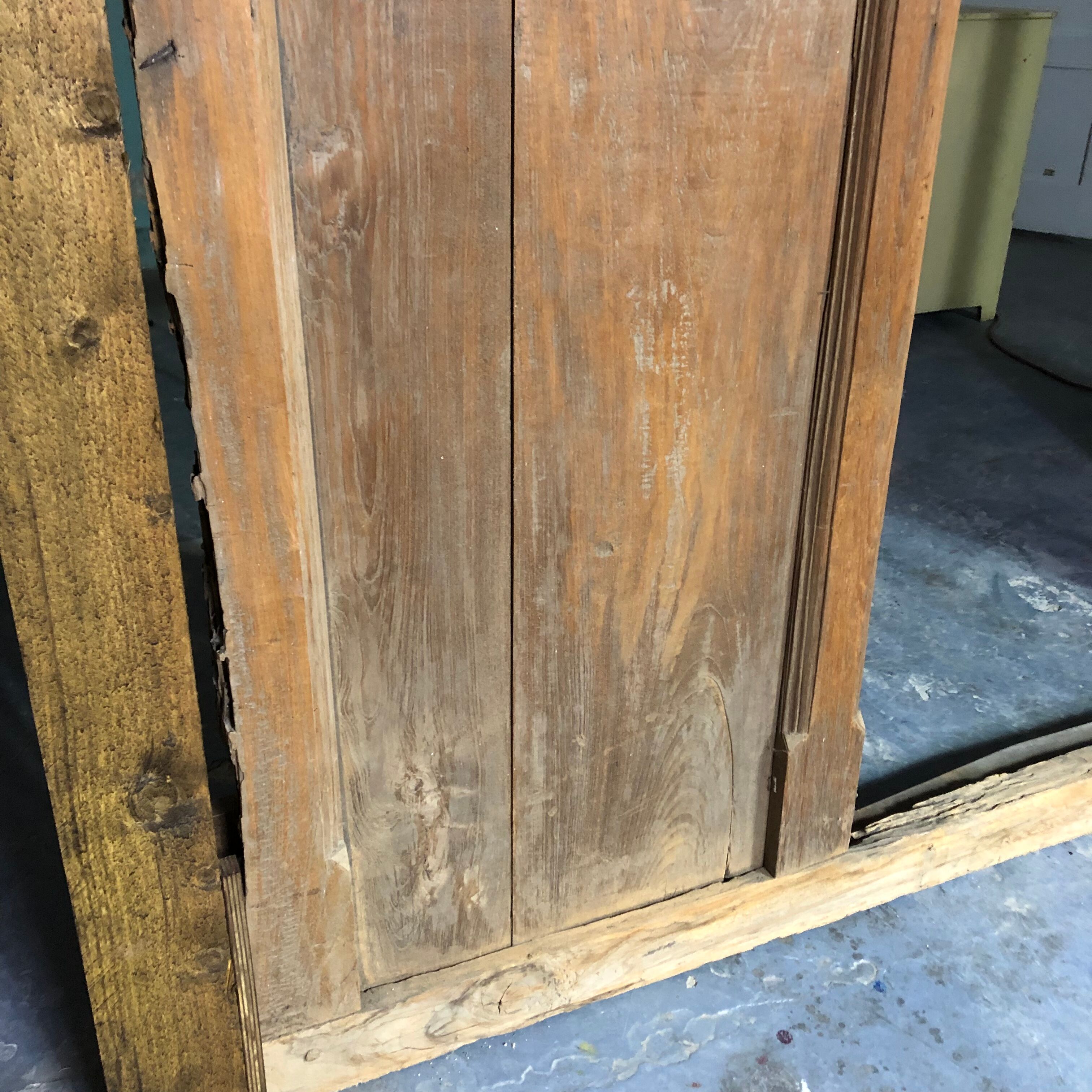 Old wooden door with its frame