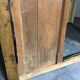 Ancienne porte en bois avec son encadrement