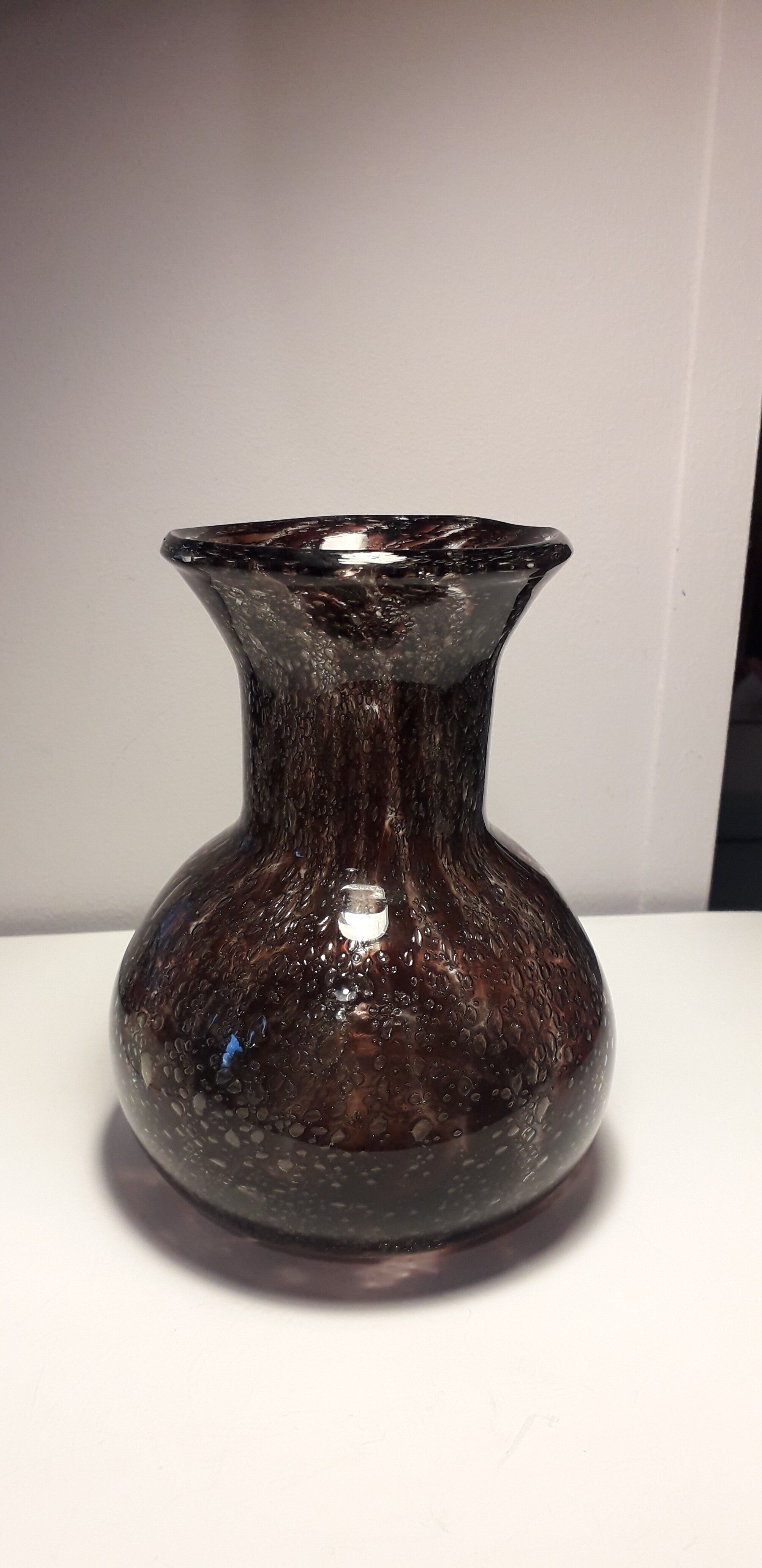 Plum-colored bubbled blown glass vase