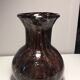 Plum-colored bubbled blown glass vase