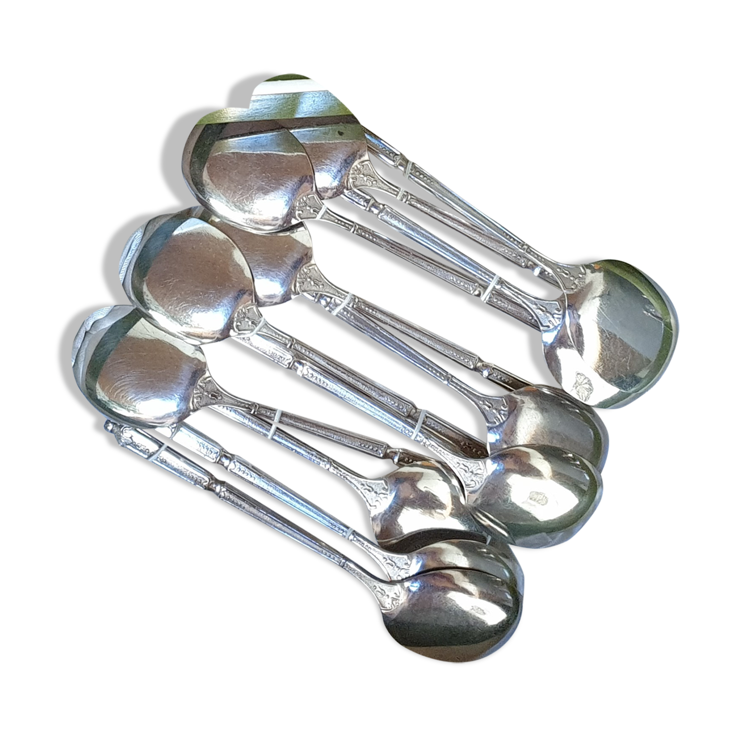 Punched silver metal ice spoons