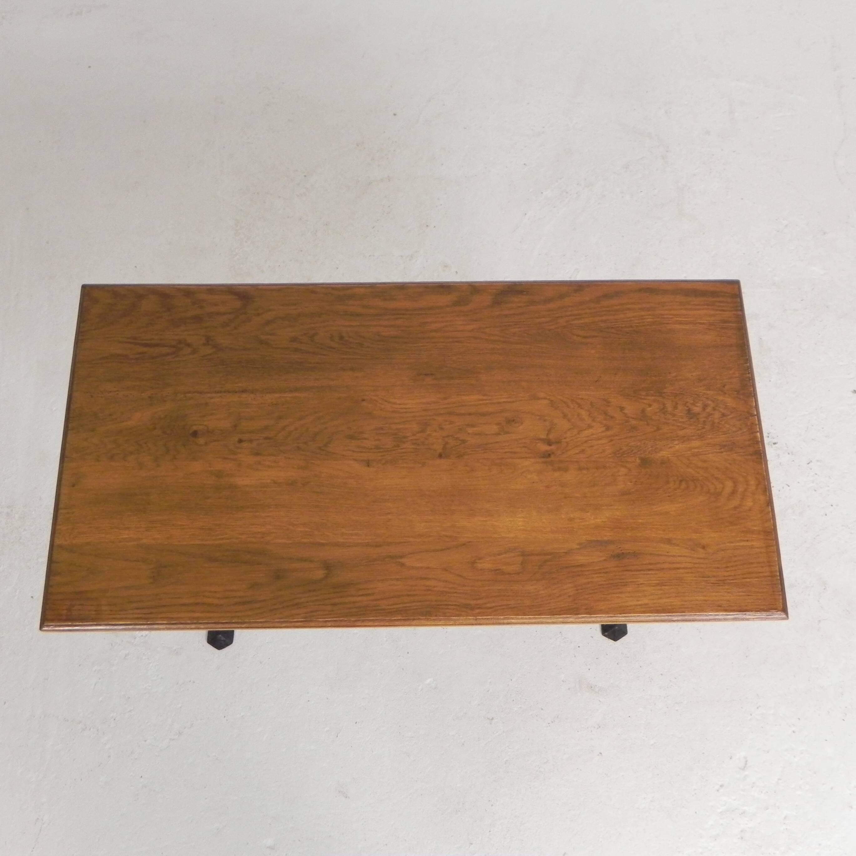 Bistro table with an oak top on a cast iron base, 1930s.
