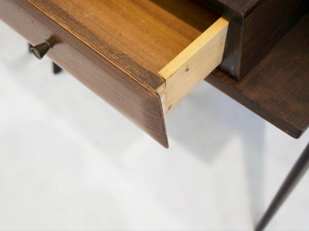 Pair of modernist Italian bedside tables in wood with a glass top.