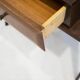Pair of modernist Italian bedside tables in wood with a glass top.