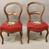 Pair of Louis Philippe walnut chairs, petit point tapestry