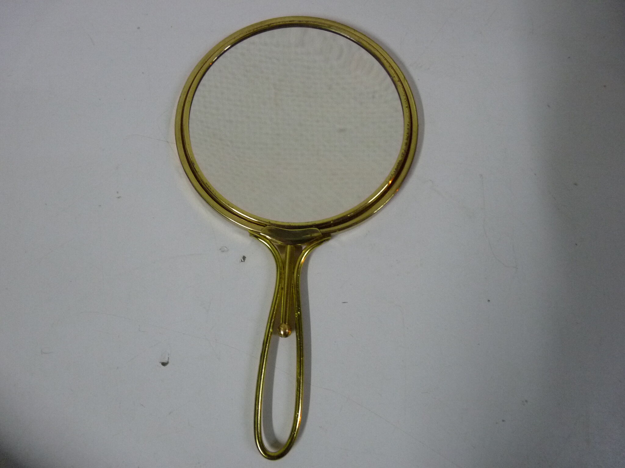 Old mirror double face with golden hand