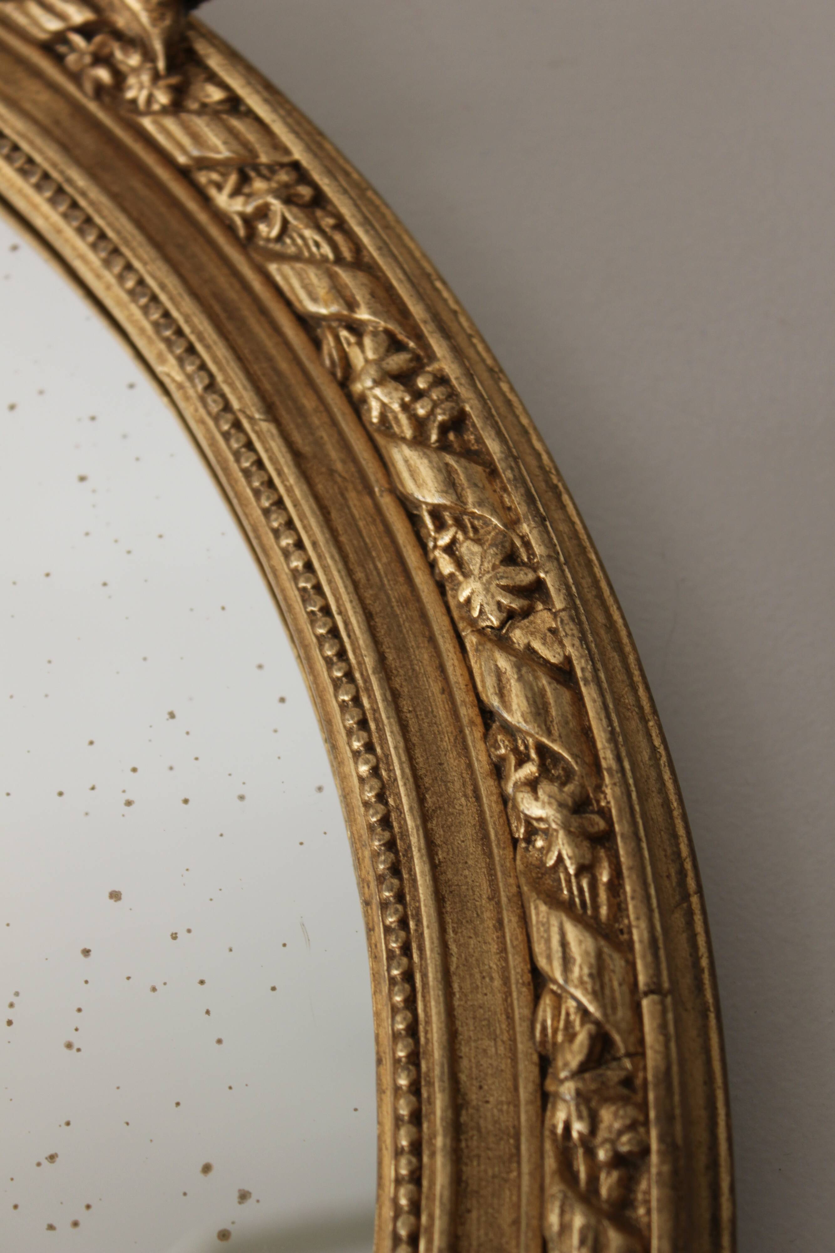 Mirror oval, golden Louis XVI style