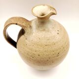 Vintage speckled brown stoneware pitcher in the shape of a ball