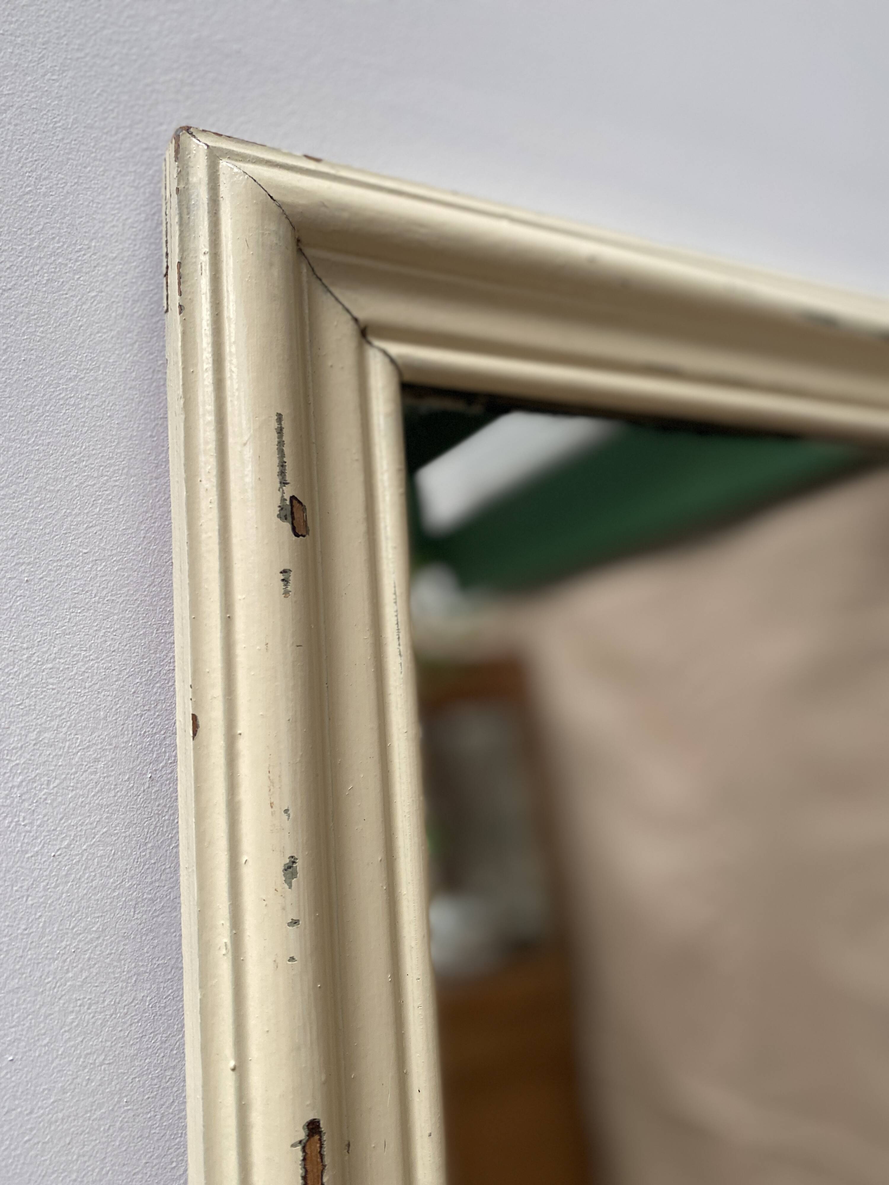 Antique mirror with beige patina