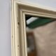 Antique mirror with beige patina